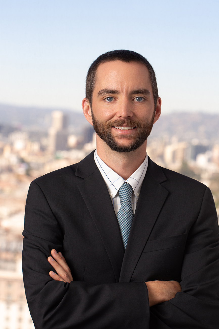 Kyle Todd head shot with arms crossed